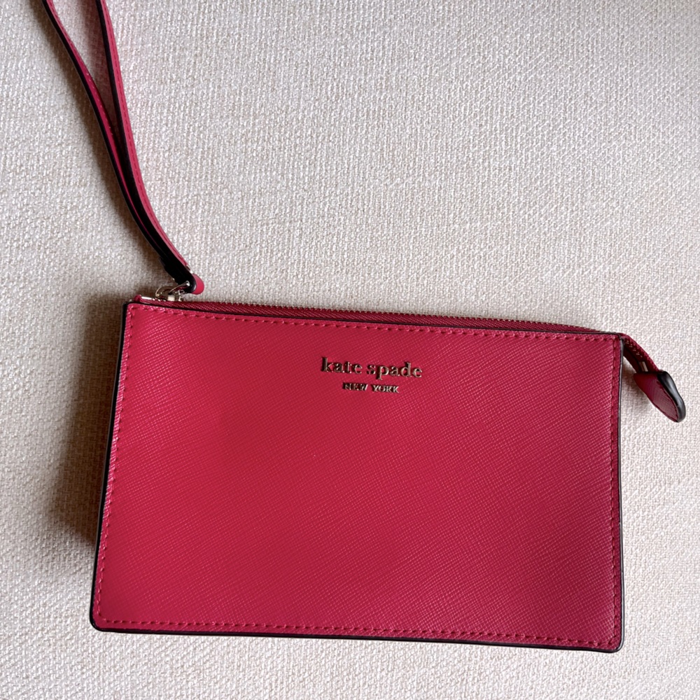 Hot pink Kate Spade New York wallet.